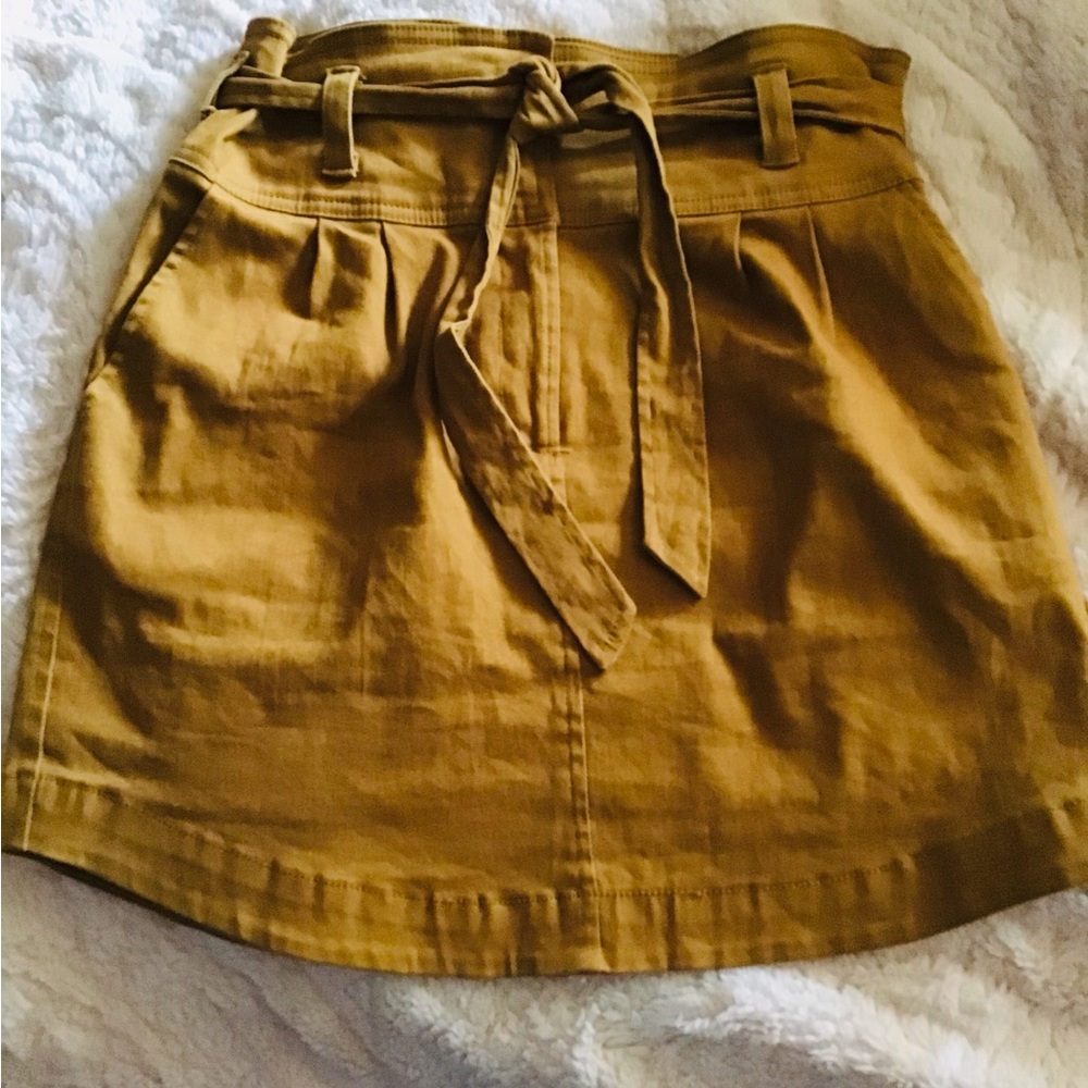 caramel colored mini skirt with tie belt and front pockets.  very cute!